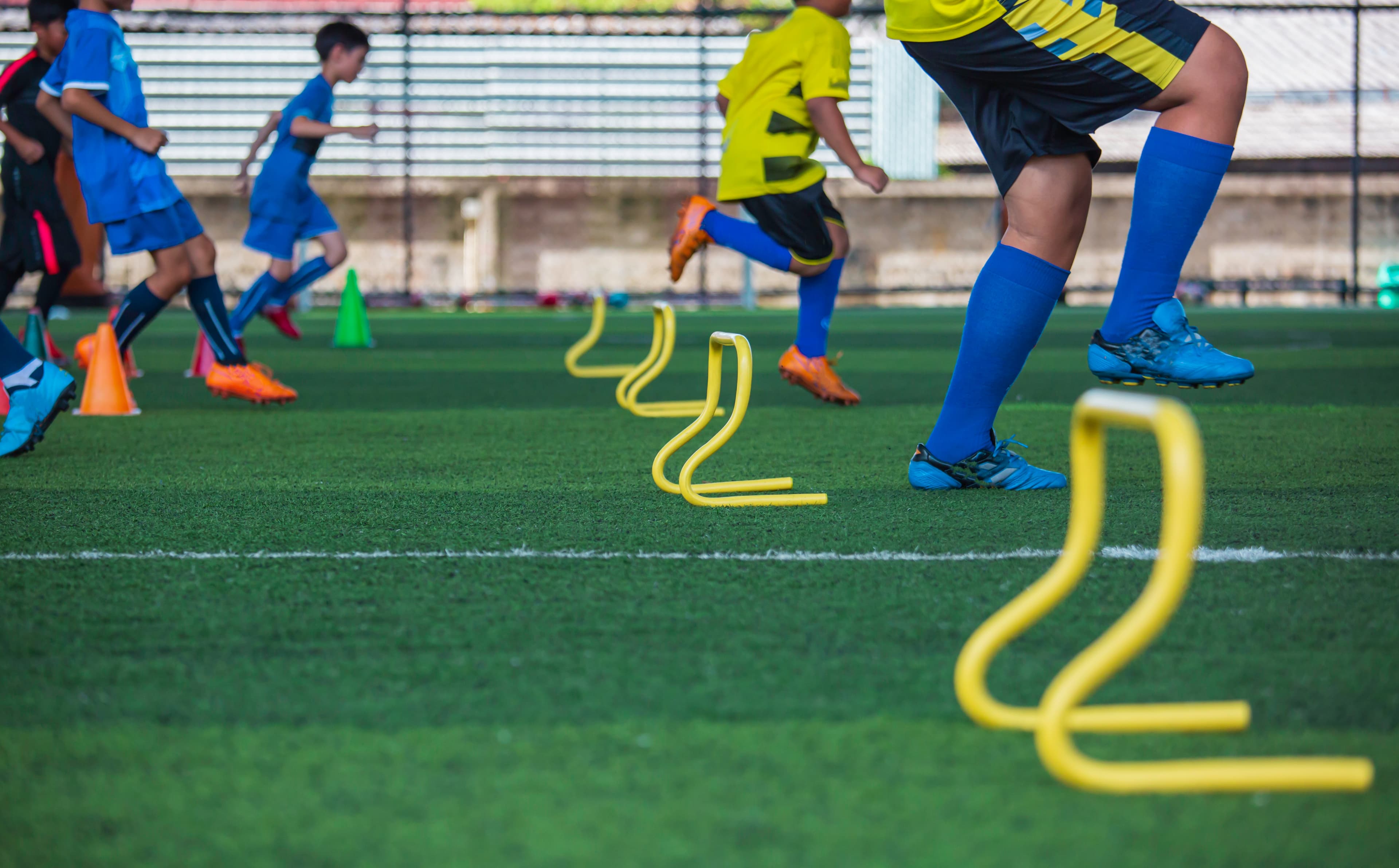 Children training on sports field